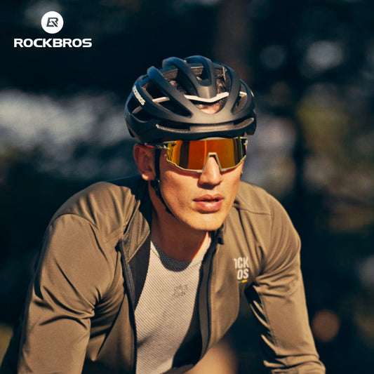 Cyclist wearing a black ROCKBROS helmet and mirrored sunglasses